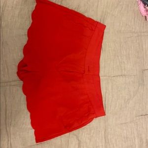 Red scalloped dress shorts.